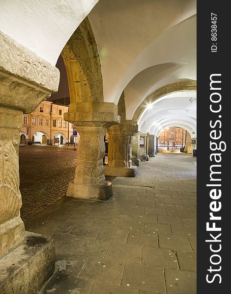 Arcade with town square in Litomysl at night lighting. UNESCO heritage.