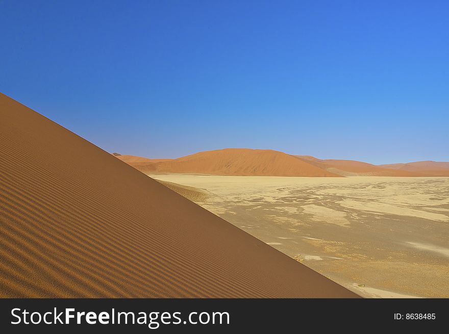 Desert Dunes Landscape With Blue Sky