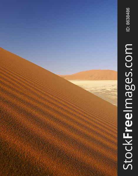 Dunes In The Desert With A Blue Sky