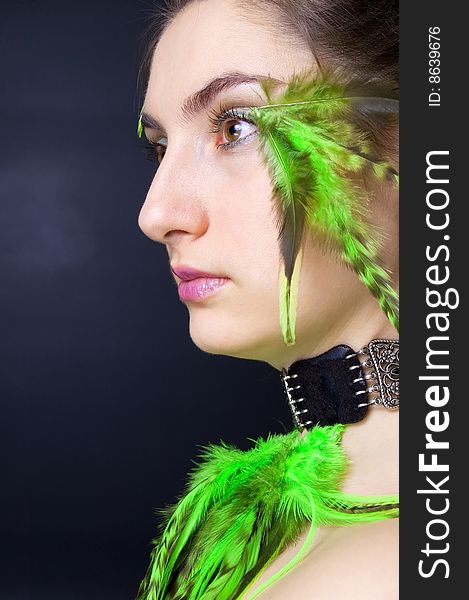 Portrait beautiful woman with long hair and feathers, vertical. Portrait beautiful woman with long hair and feathers, vertical