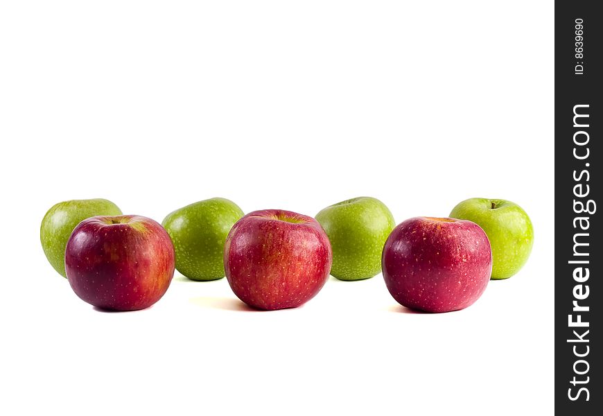 Seven red and green apples on a white background. Seven red and green apples on a white background