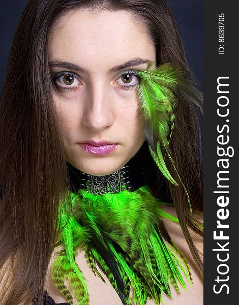 Portrait beautiful woman with long hair and feathers, vertical. Portrait beautiful woman with long hair and feathers, vertical