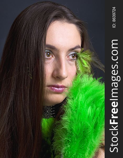 Portrait attractive young woman with green fan, vertical. Portrait attractive young woman with green fan, vertical