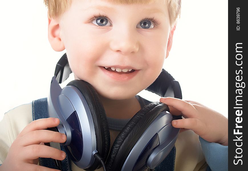 Portrait of the beautiful child in headphones. Portrait of the beautiful child in headphones