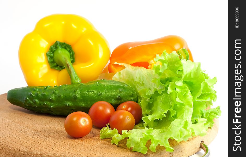 Fresh vegetables for salad on board