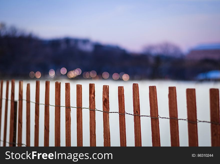 A cedar wood fence bars access to the Ellipse, a large lawn in front of the White House, on a snowy day in Washington, DC. Dedicated to the public domain with a CC0 license. A cedar wood fence bars access to the Ellipse, a large lawn in front of the White House, on a snowy day in Washington, DC. Dedicated to the public domain with a CC0 license.