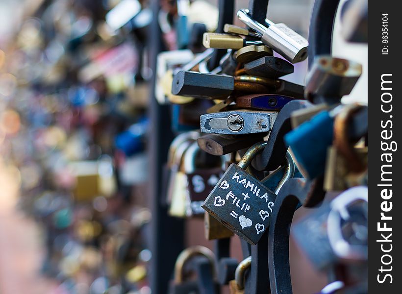 Love locks attached to the railing in the city.