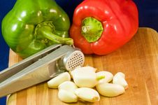 Peppers, Garlic Cloves And Press Royalty Free Stock Photo Peppers, Garlic Cloves And Press Royalty Free Stock Photo