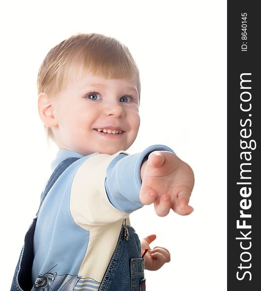 The child laughs at a white background