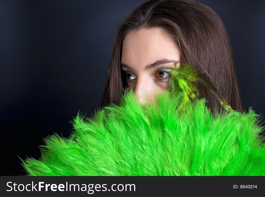 Portrait attractive young woman with green fan. Portrait attractive young woman with green fan