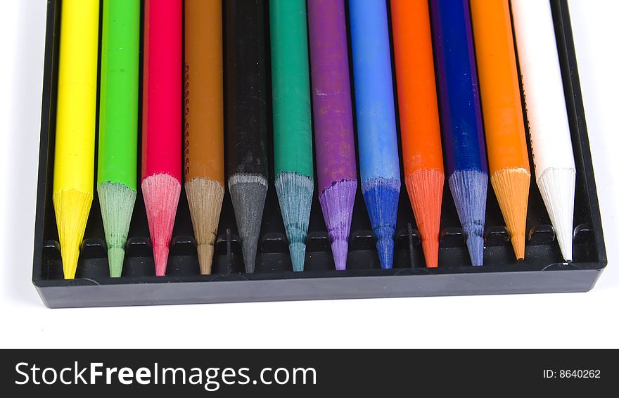 Set of color pencils woodless in black box close up