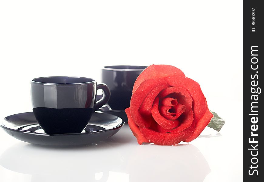 Red rose with coffee cups. Red rose with coffee cups