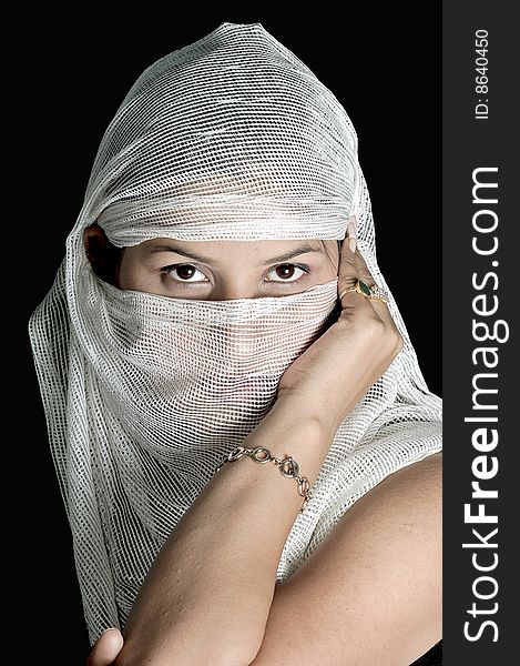 Arabian girl covering her face with white stole