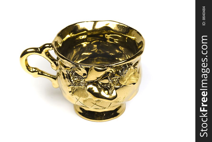 Elegant tea cup from gold with ornaments