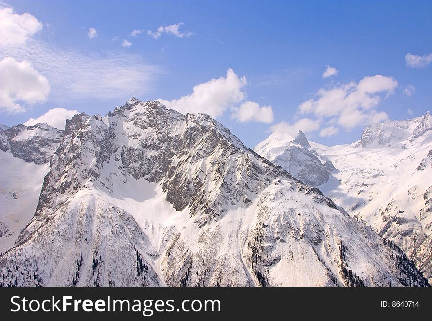 Winter Caucasus mountain, sky and clouds