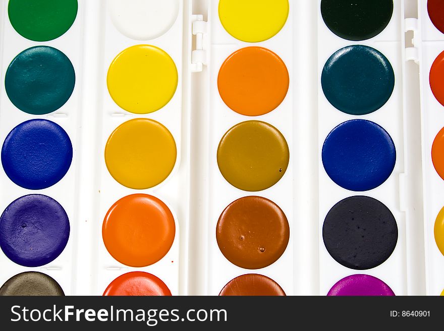 Water colour paints in capacities of the round form of various shades