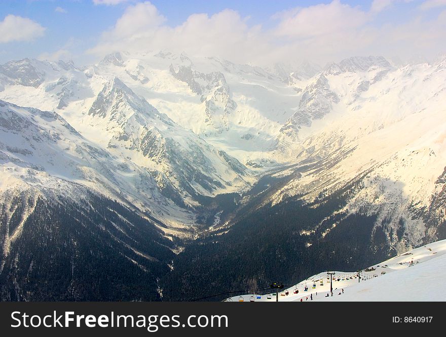 Winter Caucasus mountain, sky and clouds