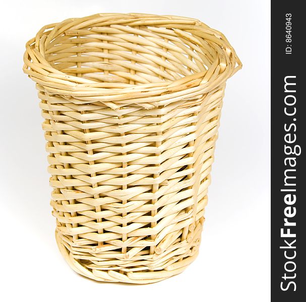 Bast basket for various trifles on a white background