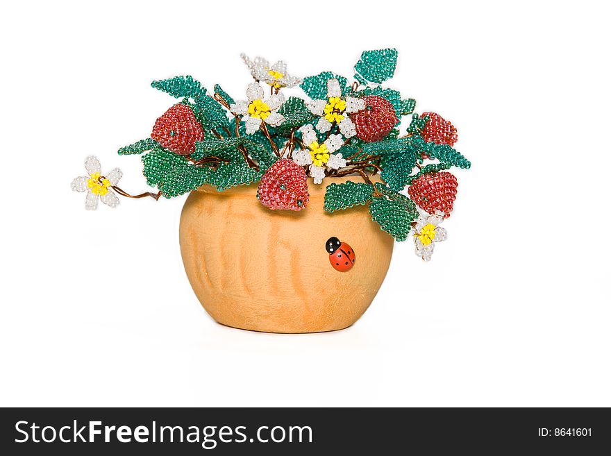 Flowers and strawberry from a bead on a white background