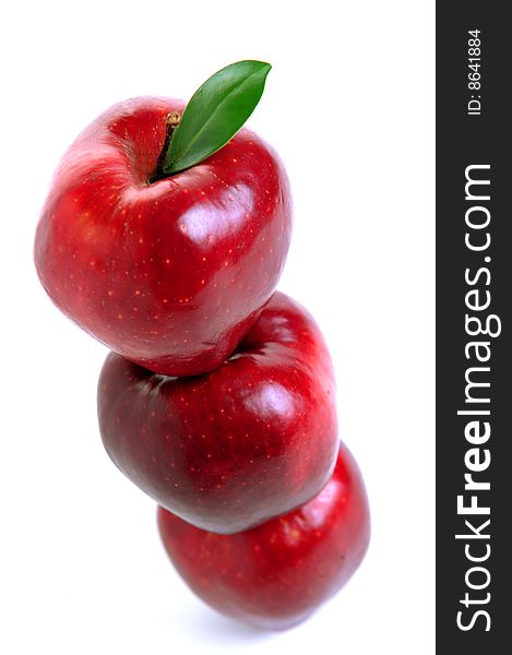 Stack of three red apple in equilibrium on white background. Stack of three red apple in equilibrium on white background