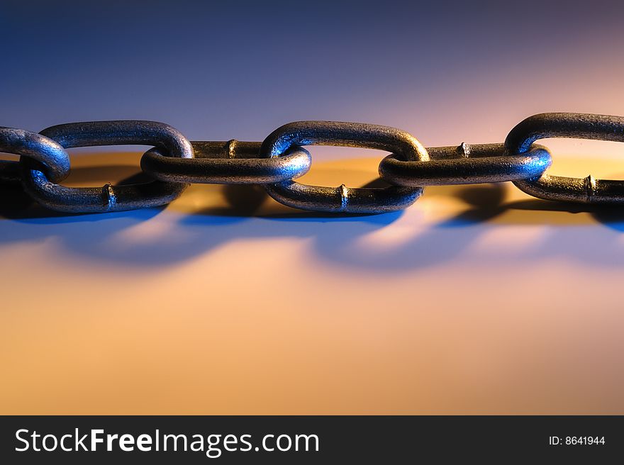 Close up of simple chain  on dramatic light