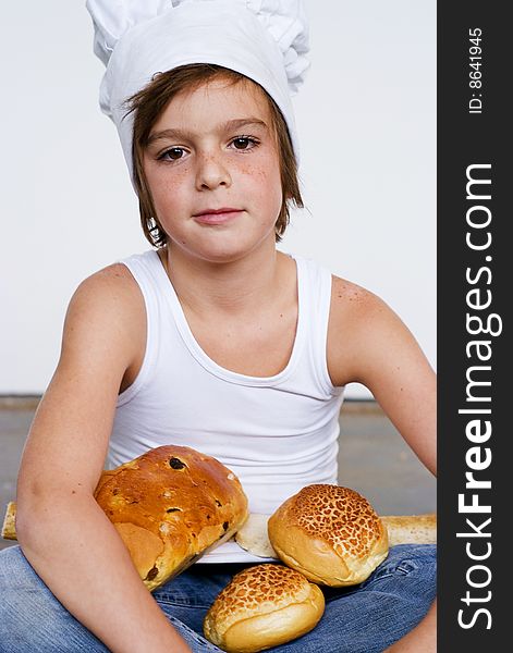 Young baker boy with bread and sandwich. Young baker boy with bread and sandwich