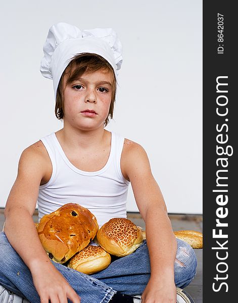 Young baker boy with bread and sandwich. Young baker boy with bread and sandwich