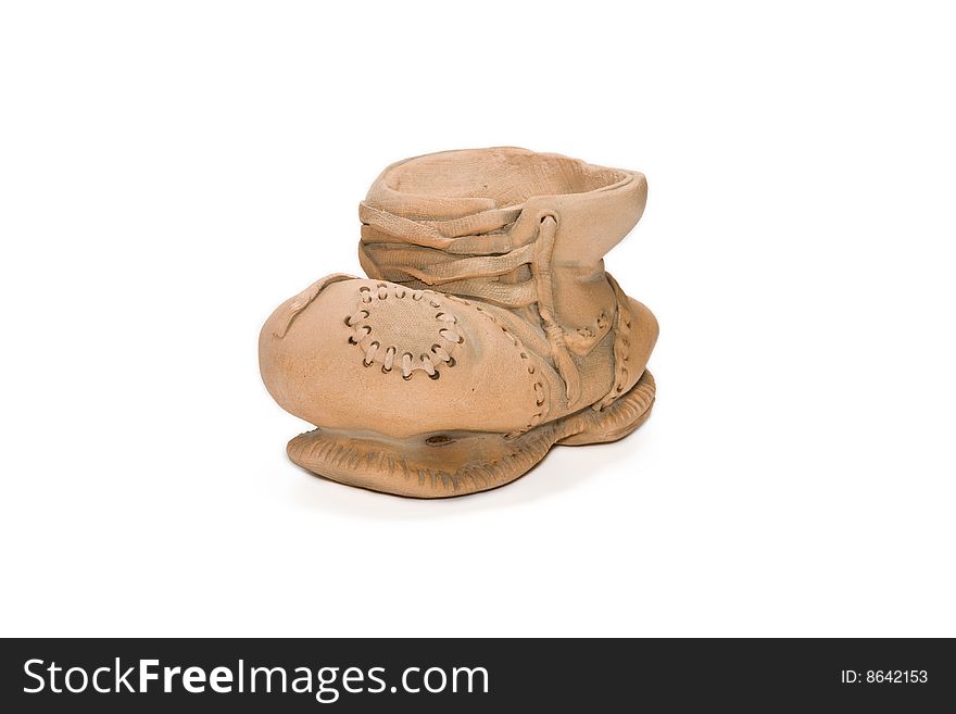Boot from clay on a white background