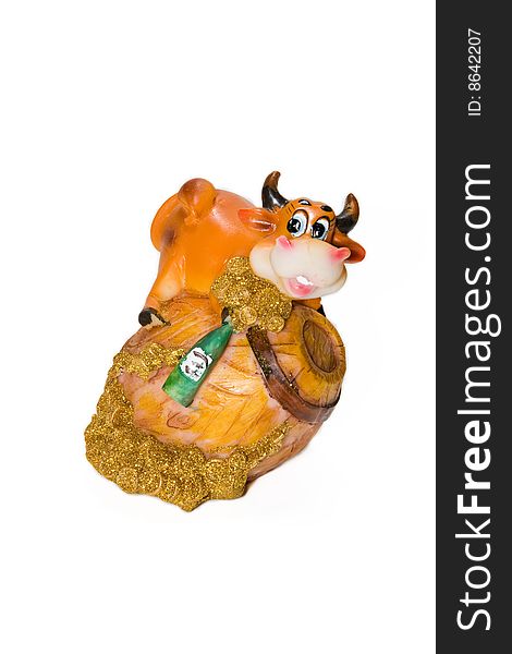 Figurine of bull on a barrel on the white background