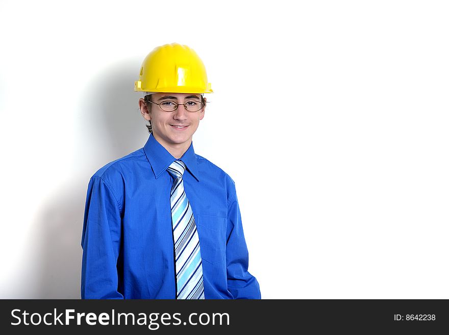 Young engineer wearing hard hat, ion white background
