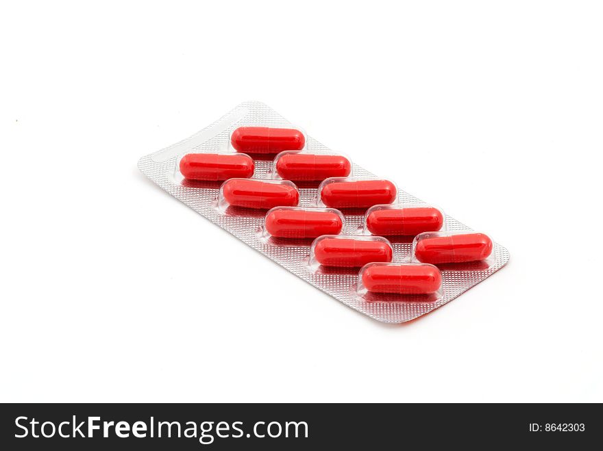 Red capsules dietary supplement in blister pack