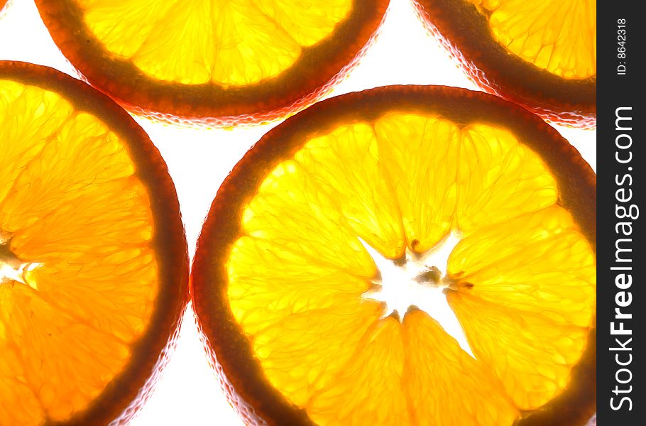 Background of orange fruits slices, close up