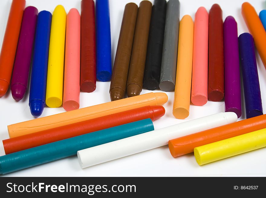 Set of children's oil pencils on a white background