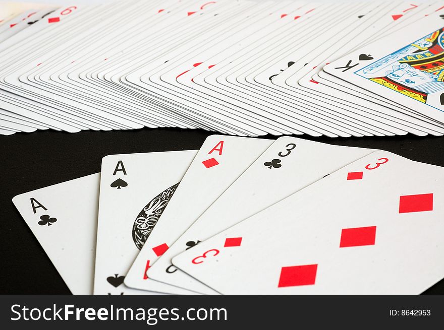 An image of a hand of full house in a card game. An image of a hand of full house in a card game.