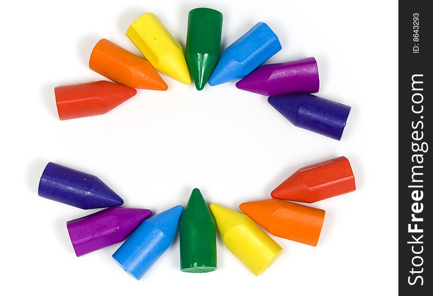 Two semicircles, their made wax crayons of all colors of a rainbow