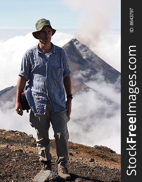 Me on top of Acatenango volcano, in the back the erupting Fuego volvano in Guatemala