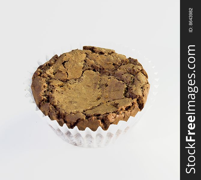 Sweet chocolate chip muffin on white background