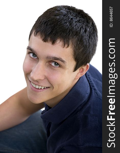 Gorgeous young man looking up at the camera and smiling. Gorgeous young man looking up at the camera and smiling.