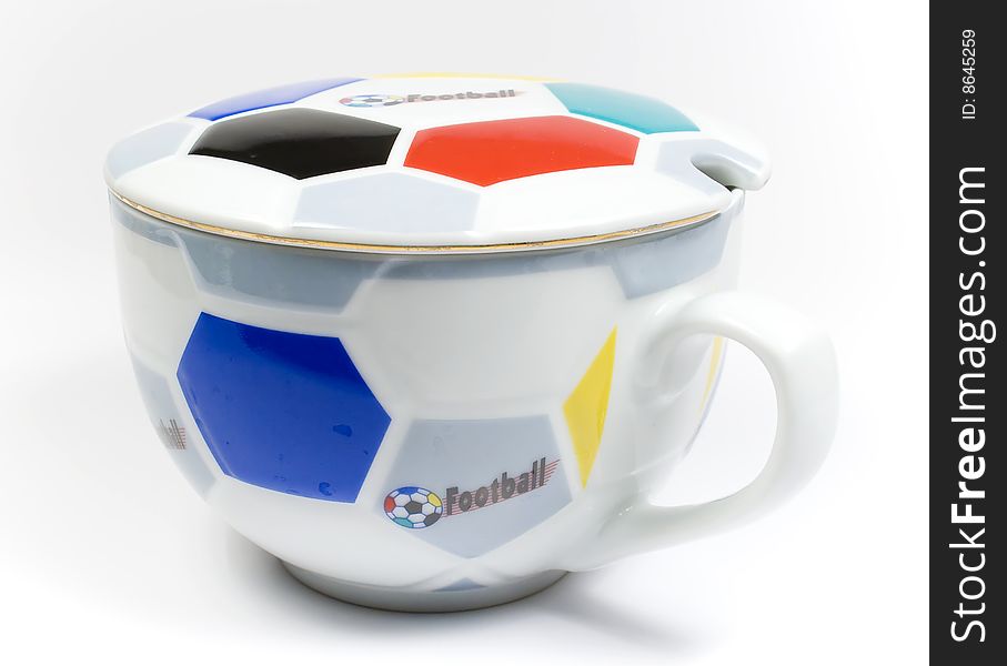 The mug of the football fan ornamented under a ball