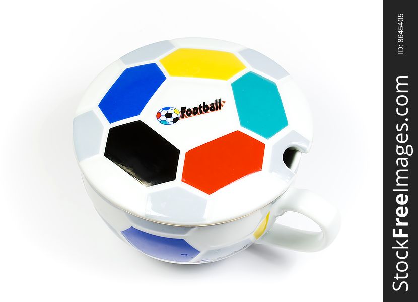 The mug ornamented under a ball with an inscription football on a cover