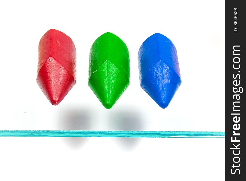 Three children's wax pencils primary colors with two shadows