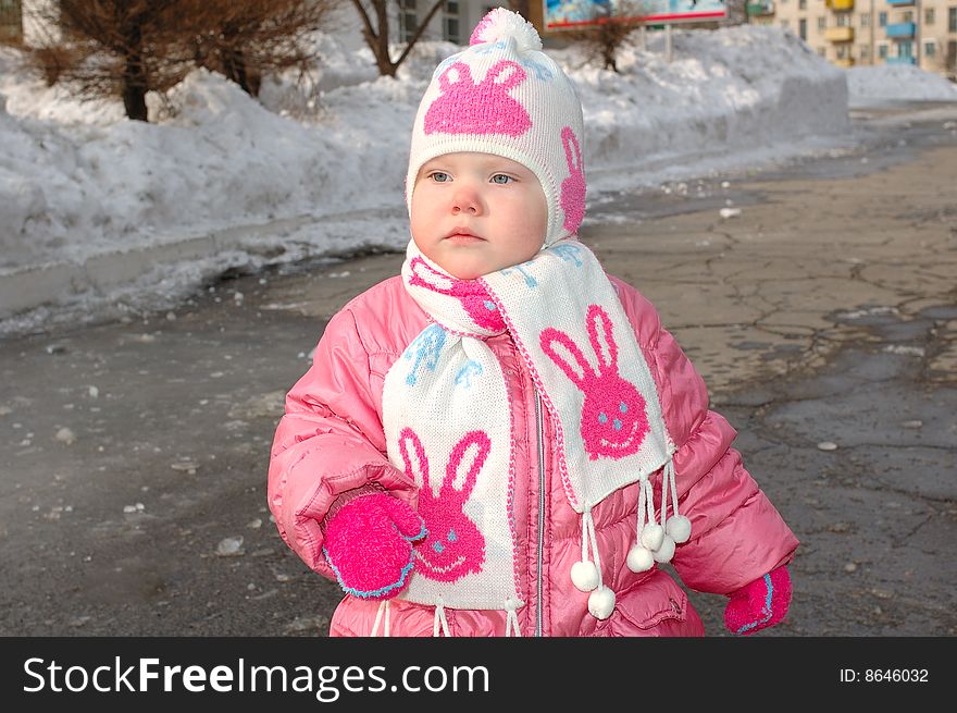 Pretty little girl in winter outerwear.