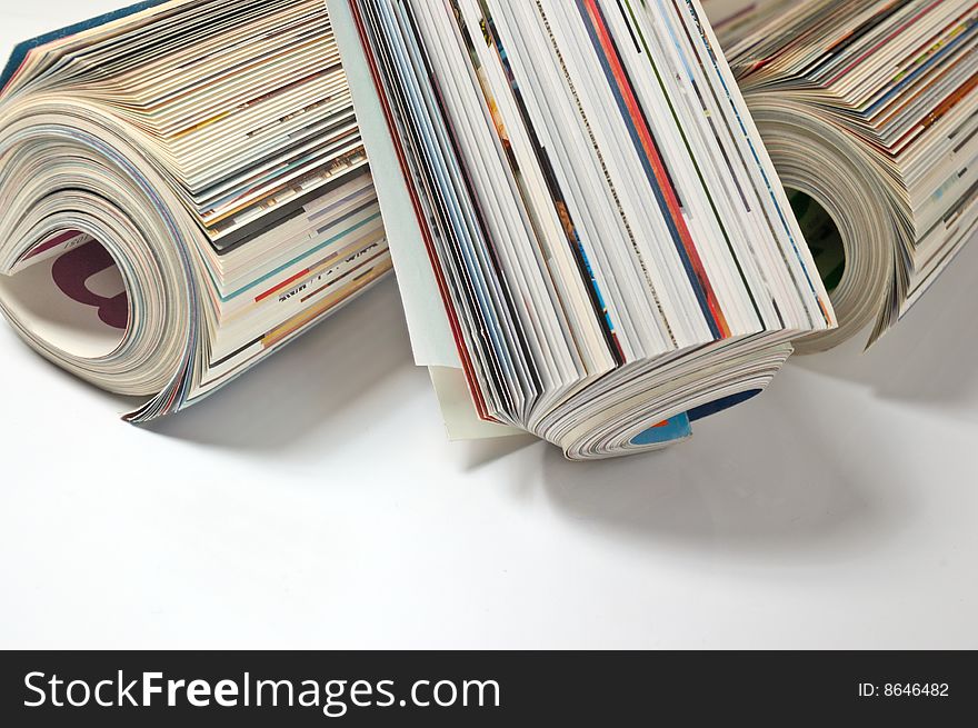 Colourful glossy magazines (on a light gray background)