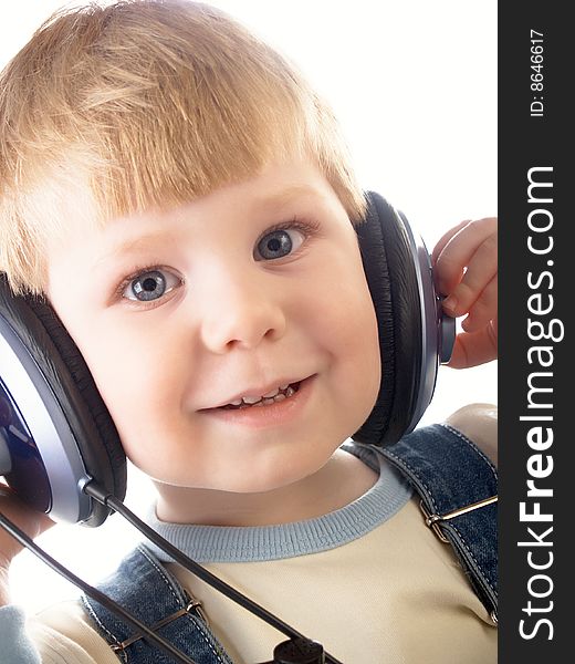 Portrait of the beautiful child in headphones. Portrait of the beautiful child in headphones