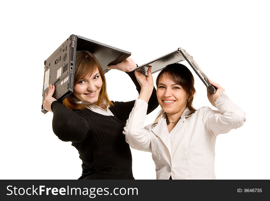 Two young businesswomen and laptop. Two young businesswomen and laptop