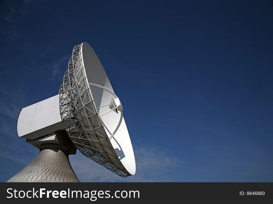 A radio telescope and blue sky, Germany