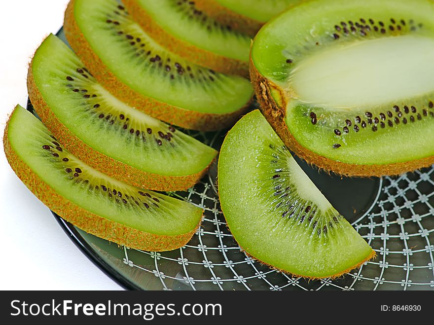 Slice fresh kiwi on a plate