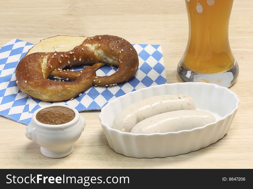 Bavarian veal sausage with mustard, pretzel and beer