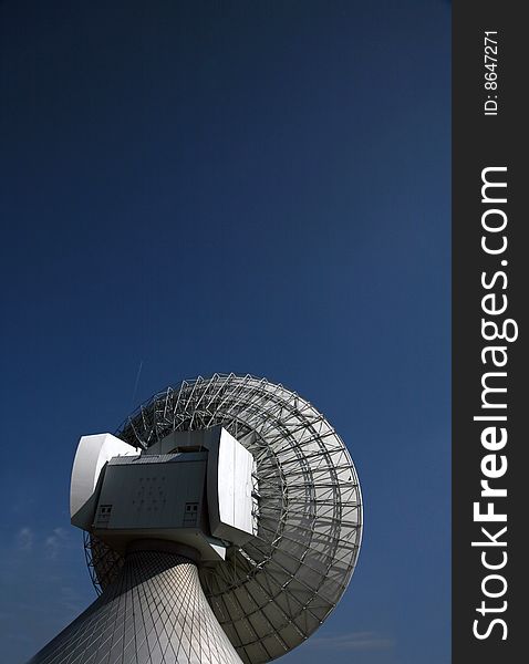 A radio telescope and blue sky, Germany