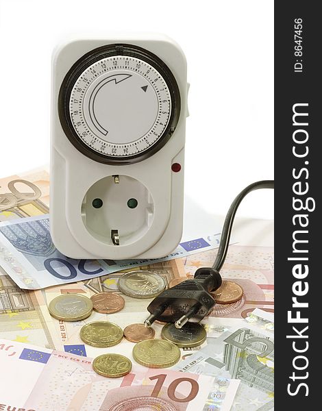 24 hours mechanical timer with Euro coins and bills over white background